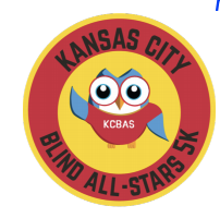 Layered circle. In yellow center a cartoon owl with big eyes and waving one wing. He is wearing a red shirt with KCBAS on front. The surrounding red ring is labeled Kansas City Blind All-Stars 5K