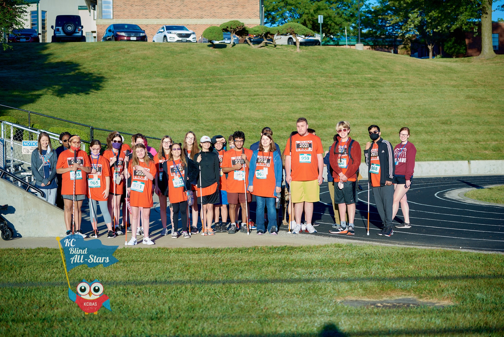 A group of Students standing on the track at KSSB getting ready for the KC Blind All Stars 5K