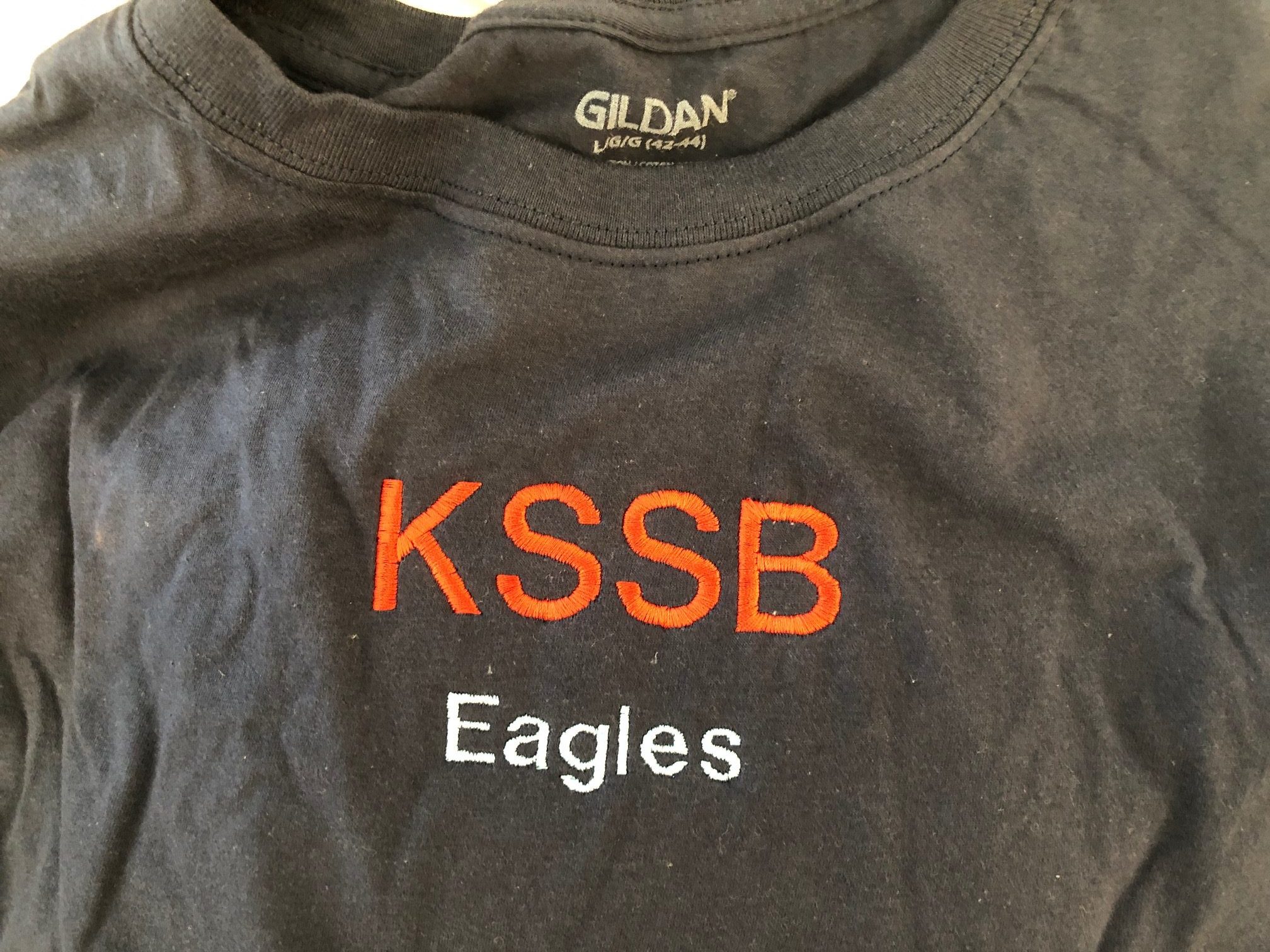 grey t-shirt with KSSB in orange and Eagles below in white, the t-shirt was created by students at the KSSB Makerspace