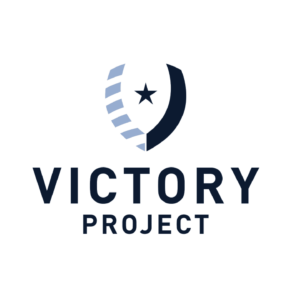 A logo has a shield in the shape of a "V" with light and dark blue elements with words that display the Victory Project underneath